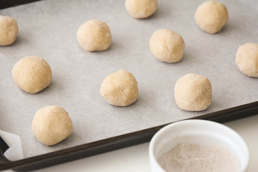 rolled and dipped balls of eggnog snickerdoodles