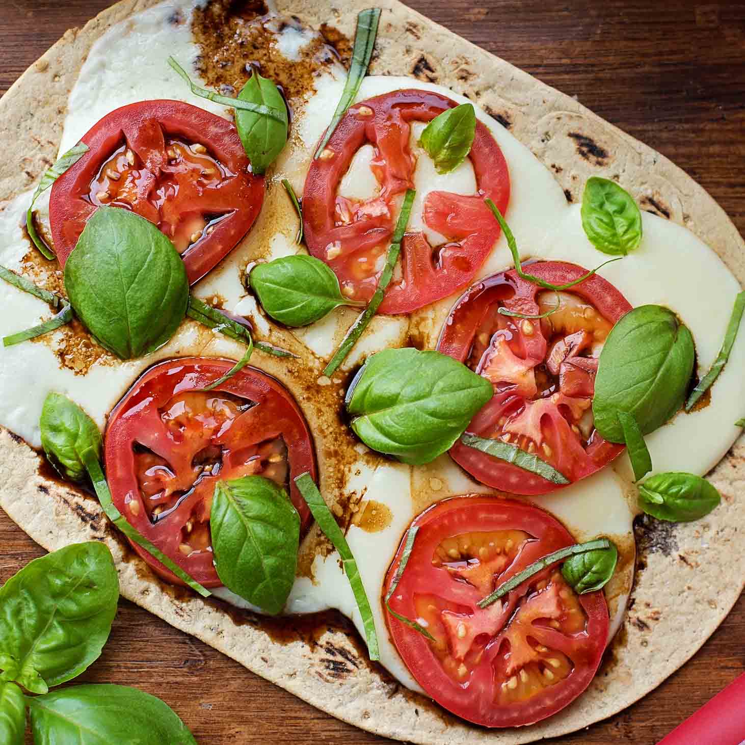 Caprese Flatbread Pizza topped with mozzarella and tomatoes.