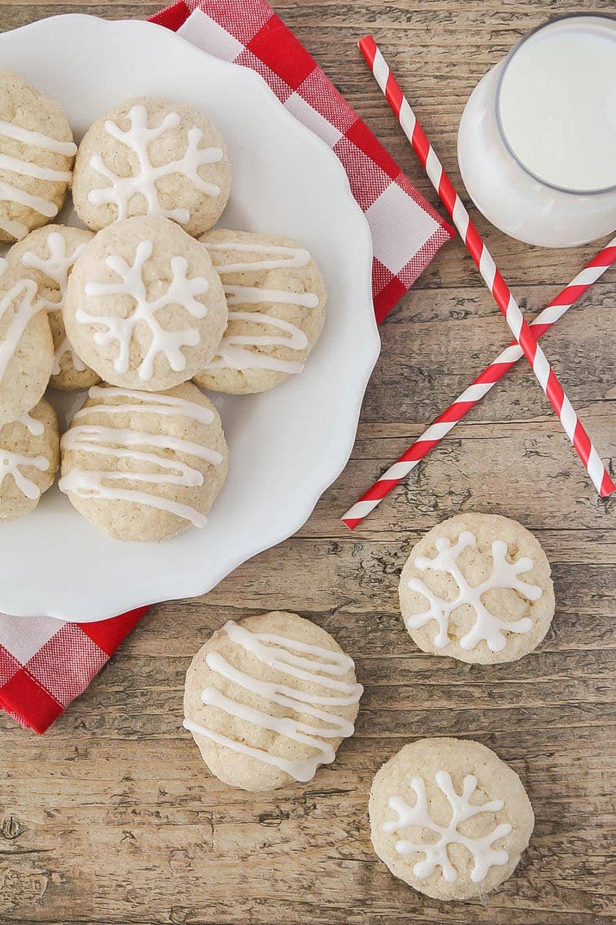 frosted Eggnog Snickerdoodles stacked on a white plate