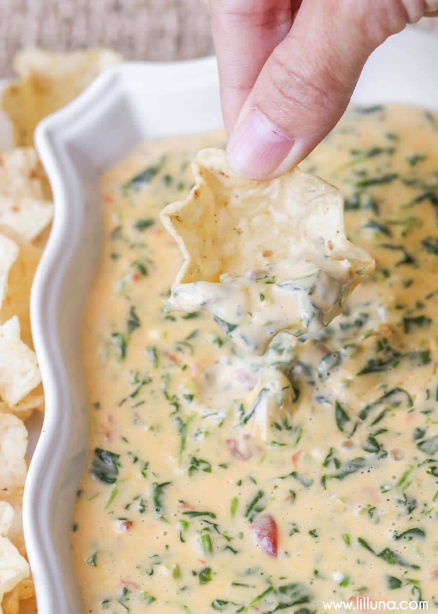 Party appetizers - baking dish filled with cheesy spinach dip.