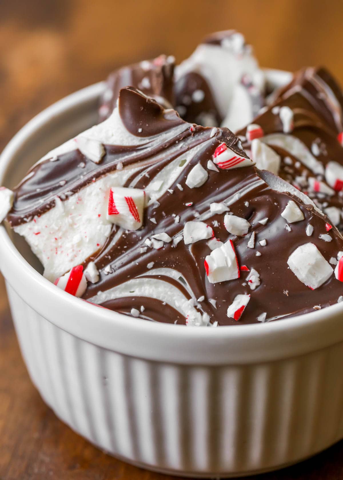 Marbled peppermint bark broken into pieces in a white bowl