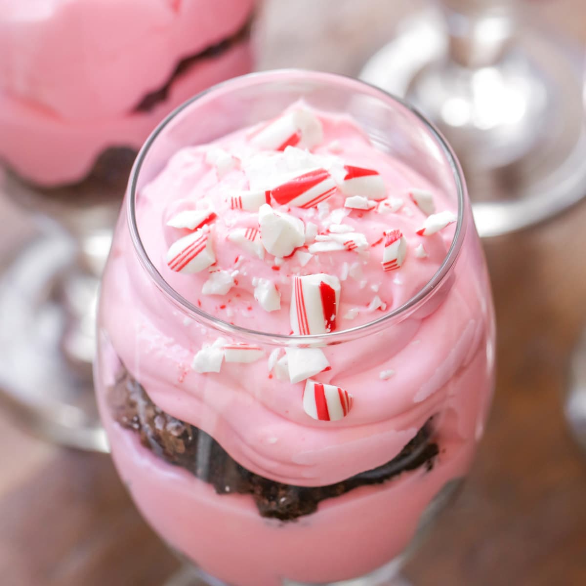 Peppermint Brownie Trifle served in a glass goblet.