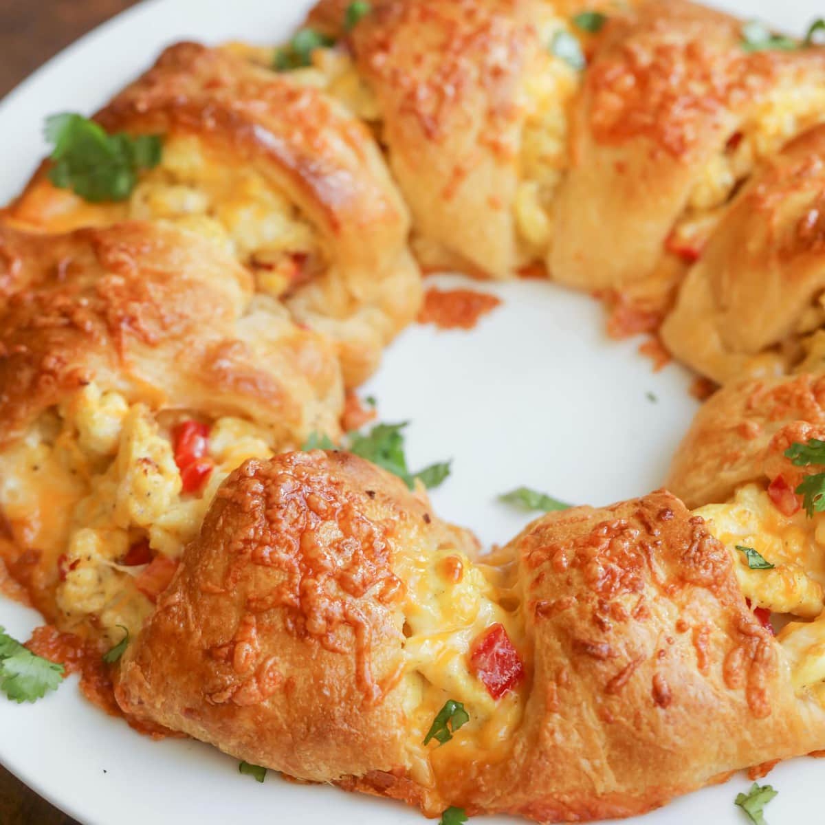 Thanksgiving breakfast ideas - a breakfast crescent ring served on a white platter.
