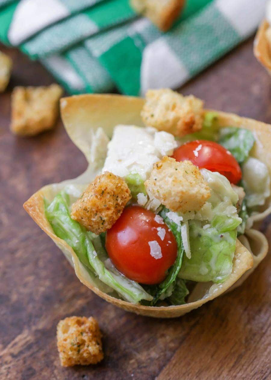 4th of July Appetizers - Caesar salad cups made from lettuce, tomato, cheese, and croutons in a wonton cup.
