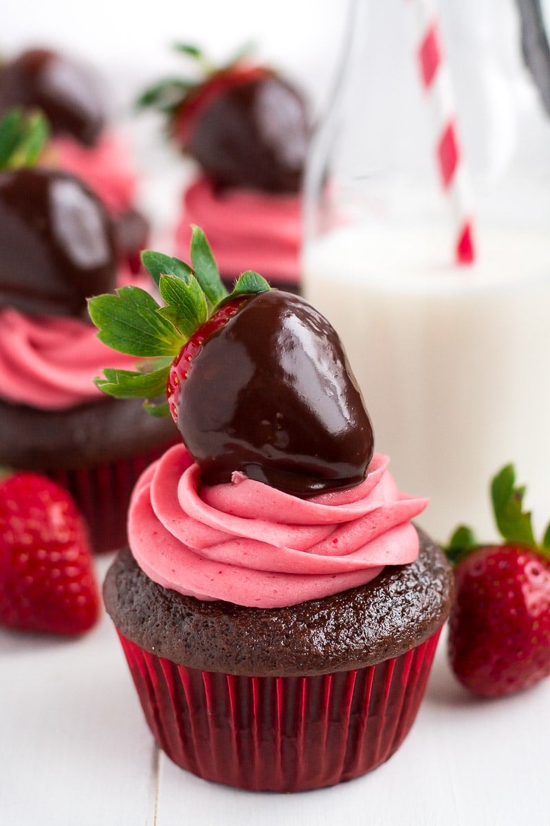 close up of a Cupcake with a Chocolate Covered Strawberry on top