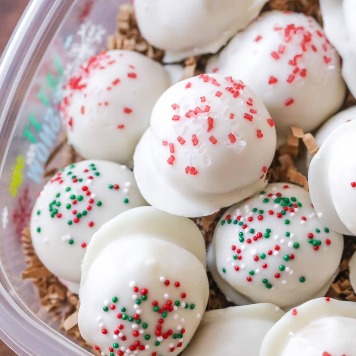 a pile of white chocolate peanut butter snowballs