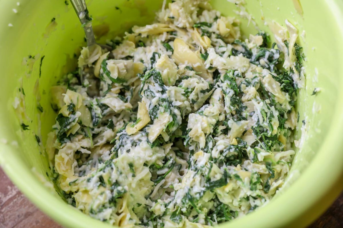 Spinach artichoke mixture in bowl for spinach artichoke grilled cheese sandwiches