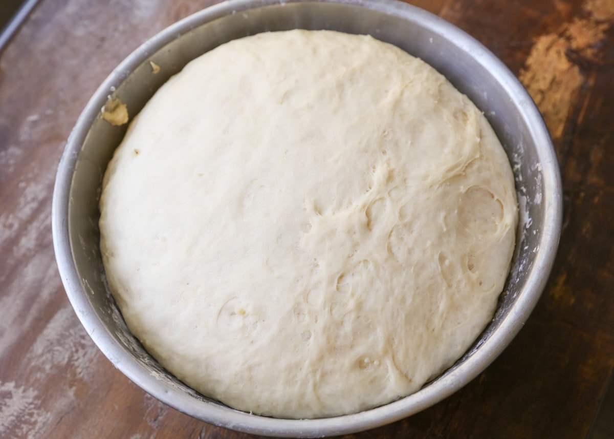 Bowl full of sticky walnut bun dough