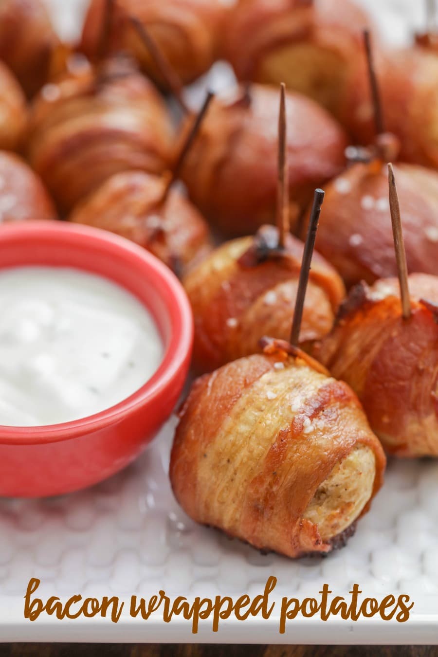 Bacon Wrapped Potatoes on toothpicks with dipping sauce