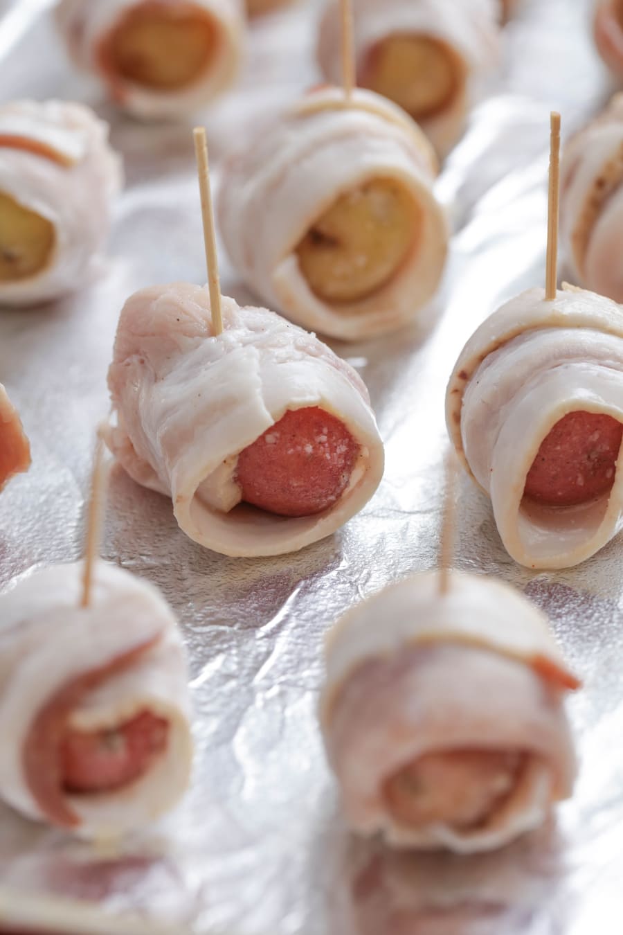 Bacon Wrapped Potatoes on a cookie sheet