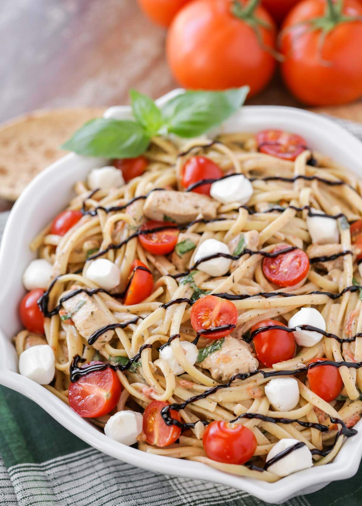 Bruschetta Chicken Pasta recipe drizzled with balsamic glaze