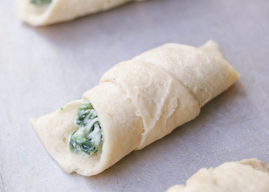 Unbaked Spinach Roll Up on a sheet pan