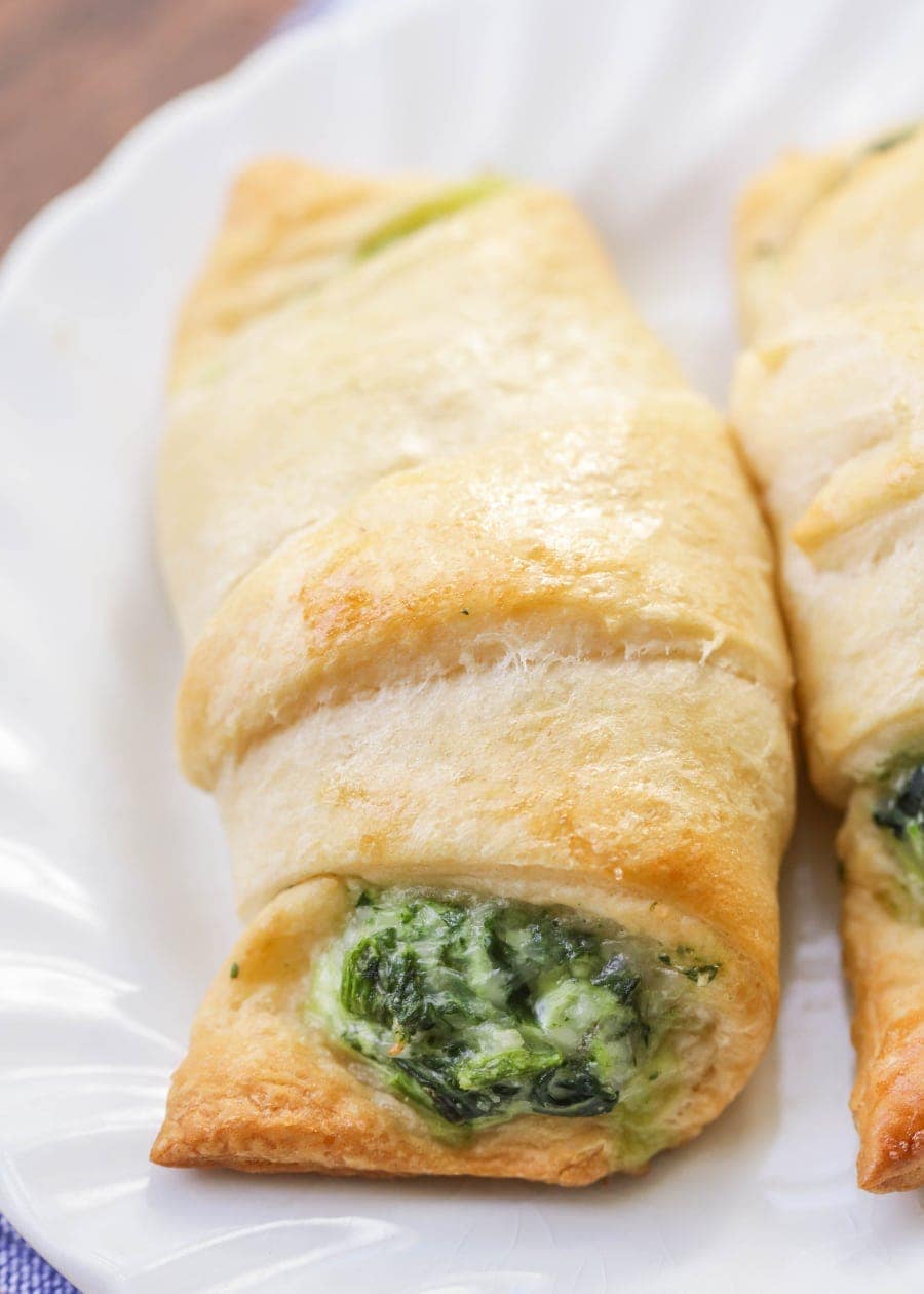 close up of spinach crescent rolls on a white plate