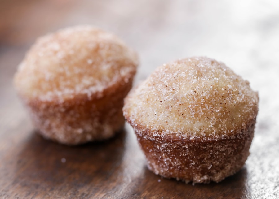 Two cinnamon sugar mini donut muffins without frosting