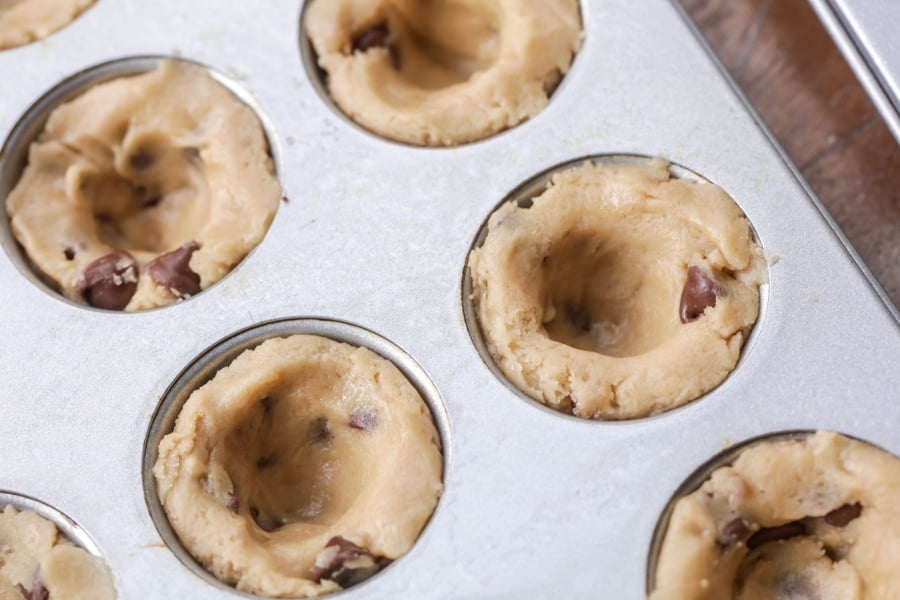 cookie dough press in a mini muffin tin