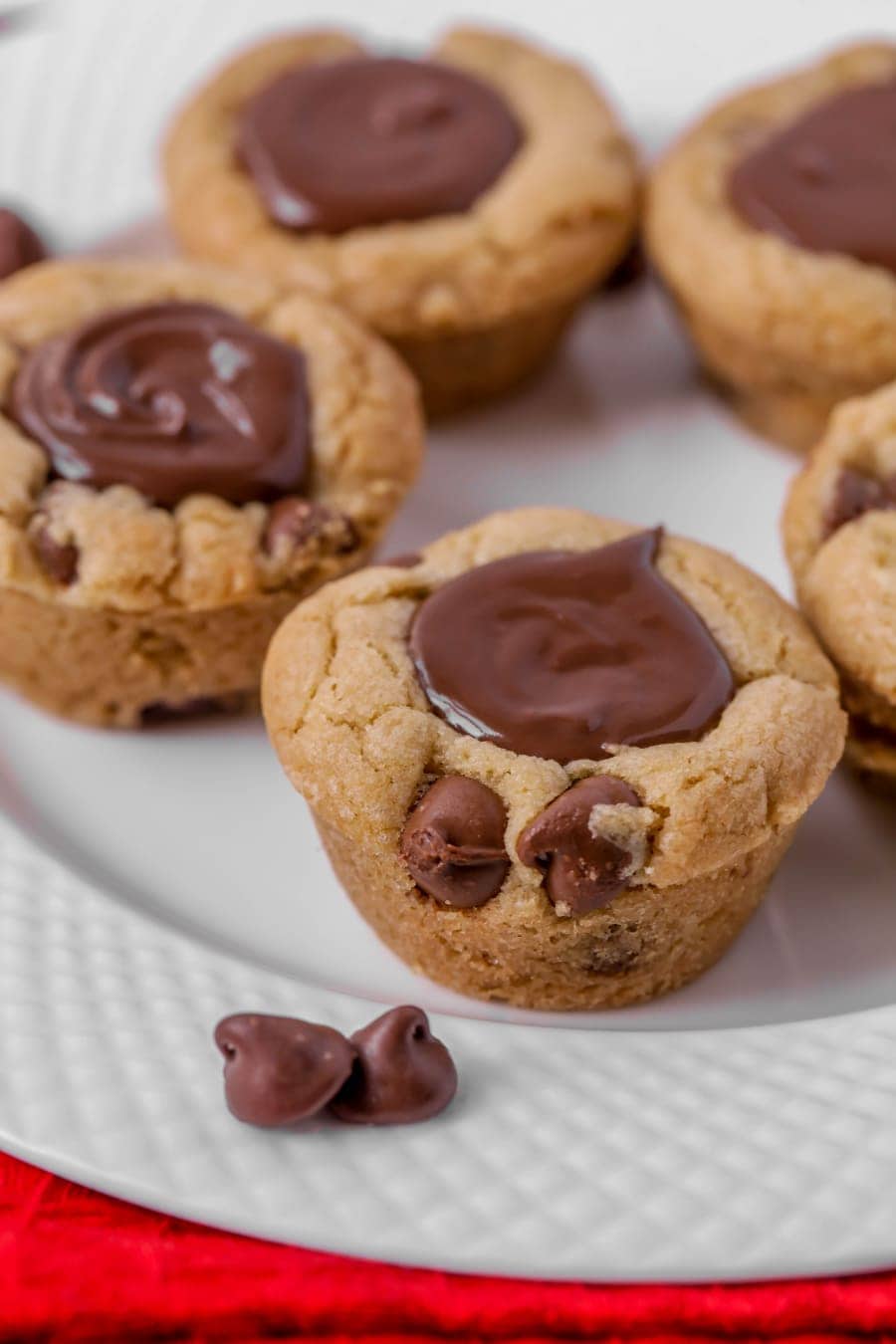 Chocolate Chip Cookie Bites filled with melted chocolate on a white plate