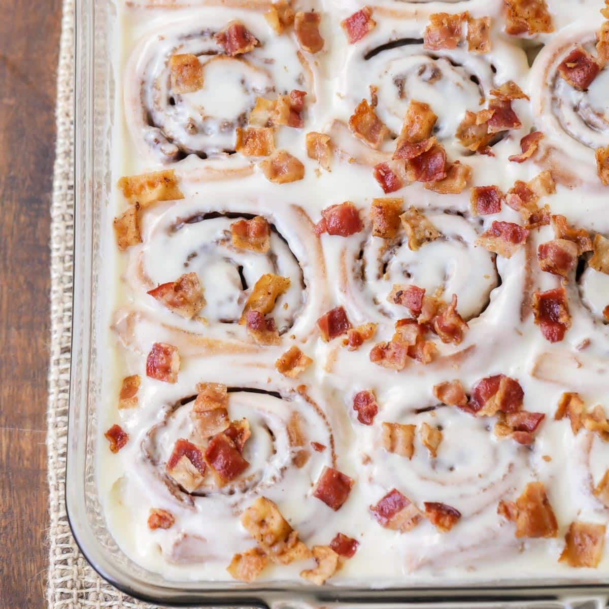 maple bacon cinnamon rolls in a baking dish