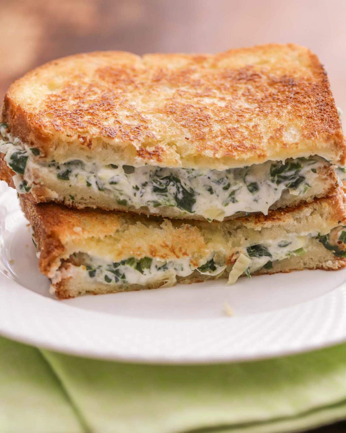 Spinach Artichoke Grilled Cheese Sandwich on white plate