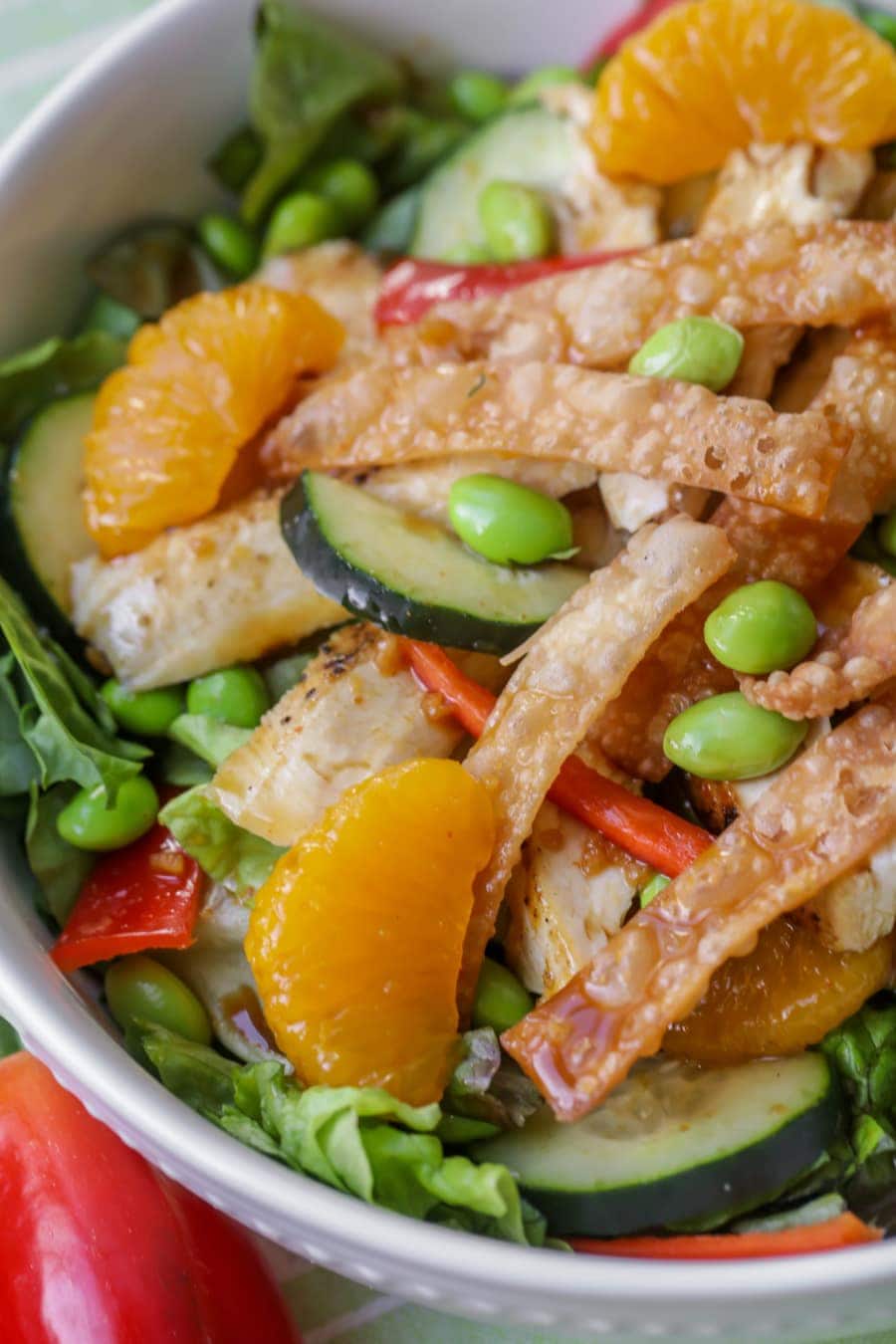 Green Salad Recipes - Asian citrus chicken salad in a white bowl.