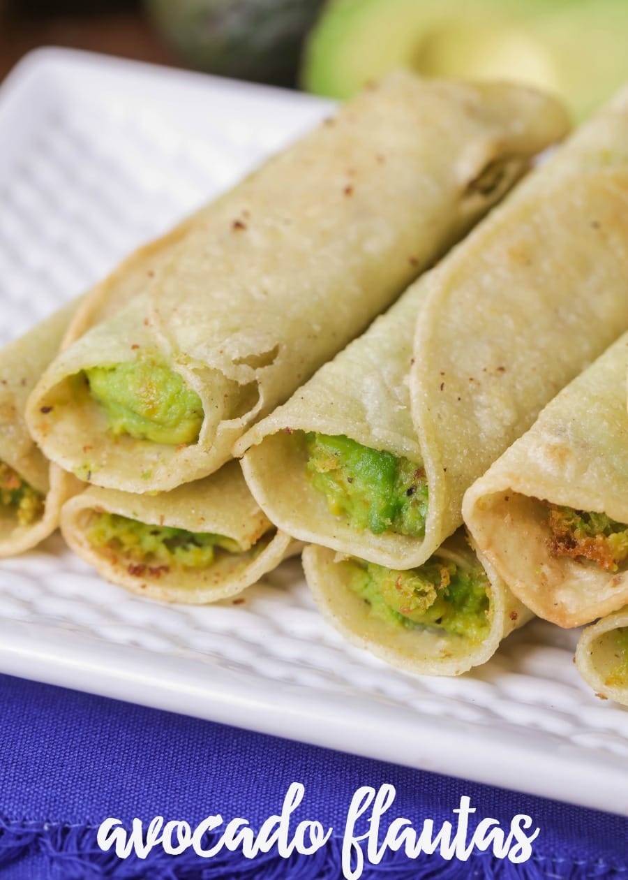Avocado Taquitos fried and stacked on a white plate