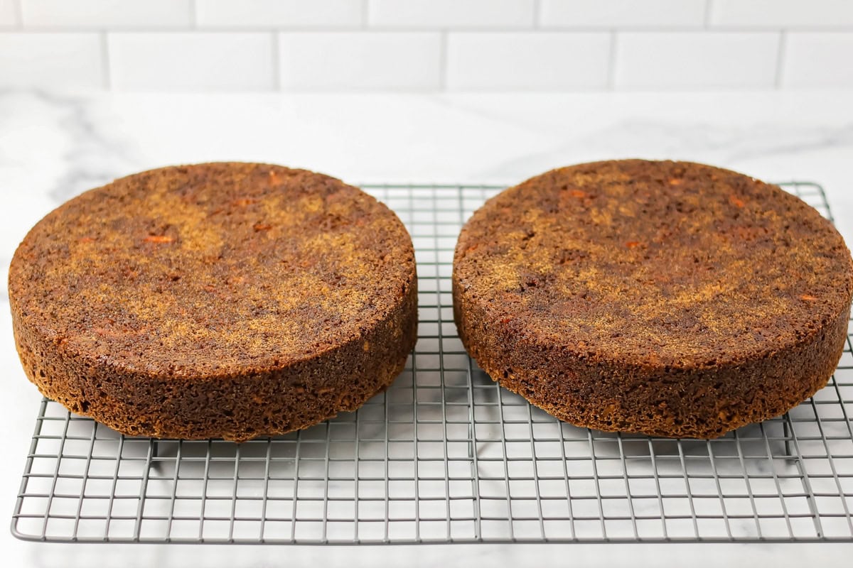 Carrot cakes cooling on wire rack.