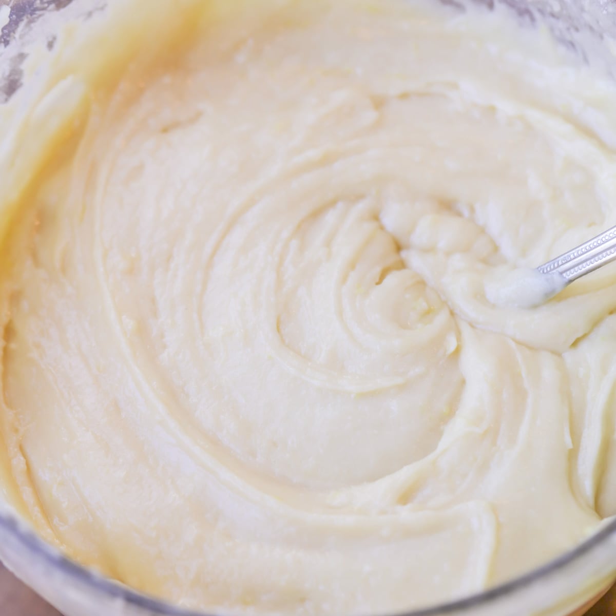 Batter for lemon muffin recipe in a mixing bowl