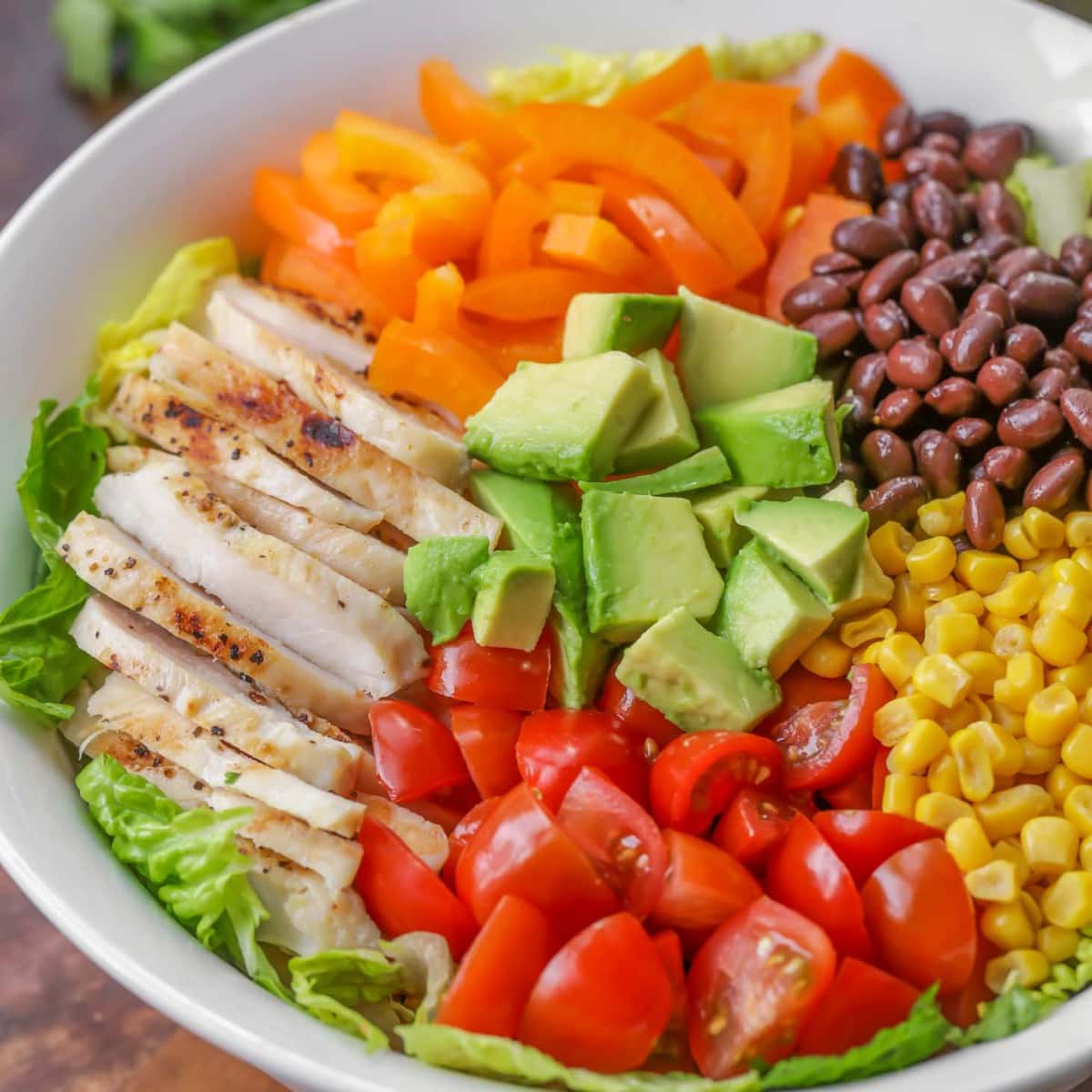 Southwest salad ingredients chopped and served in a white bowl.