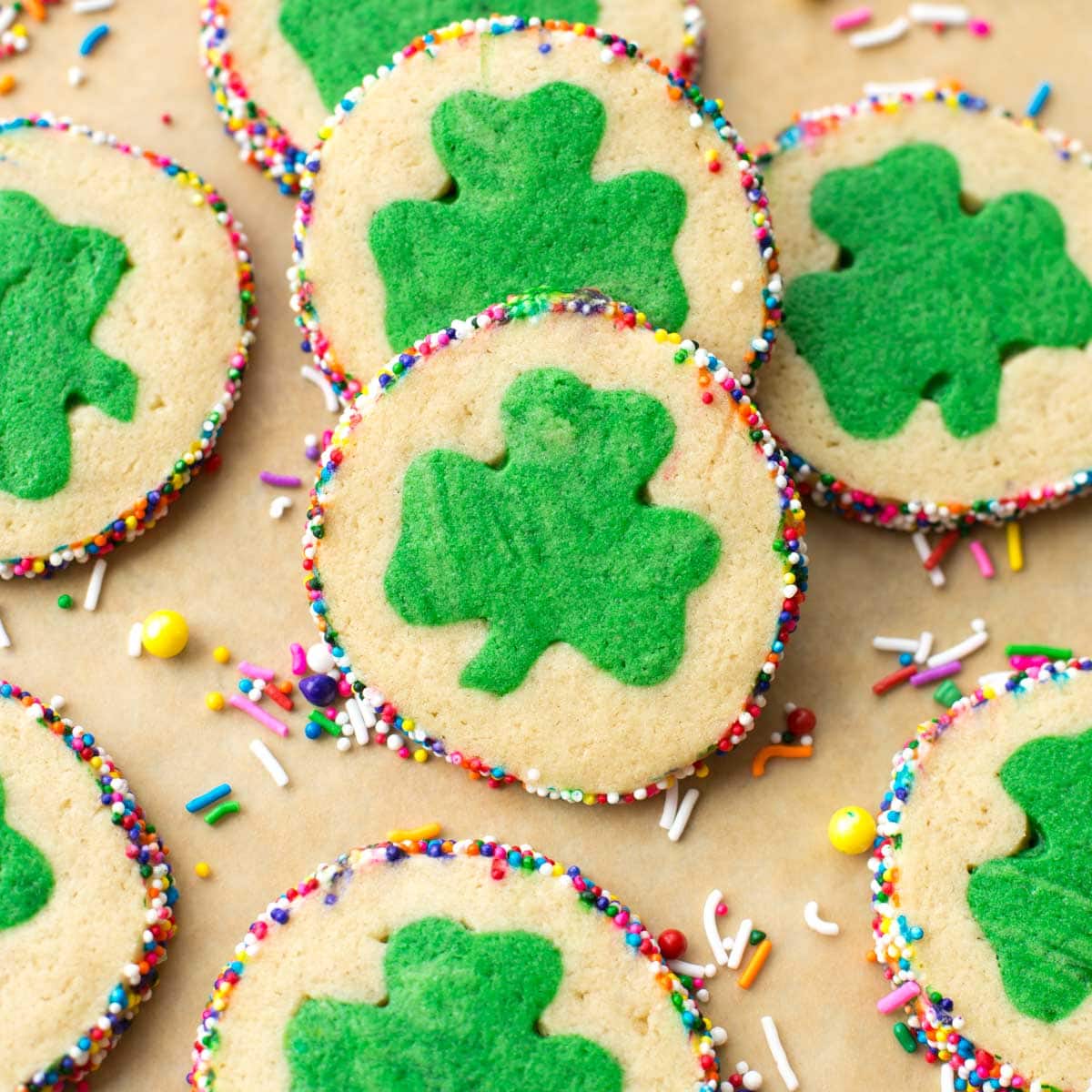 St. Patrick's Day Cookies with a clover in the middle and sprinkles on the edges.