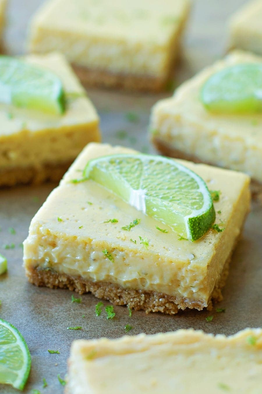 Dessert Bar Recipes - Key Lime Pie Bars topped with lime slices and lime zest. 