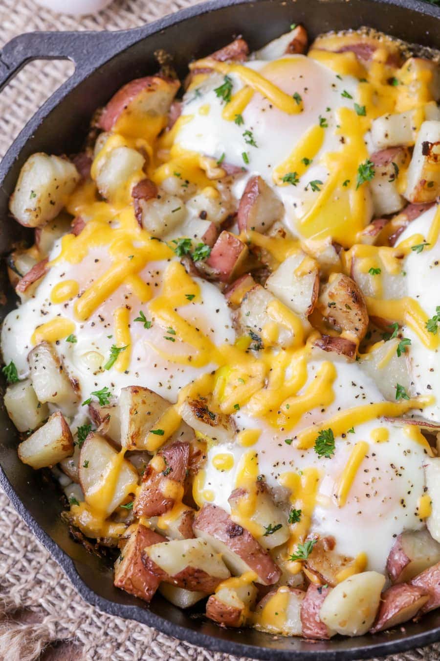 Baked Cheddar Eggs & Potatoes - the best way to make breakfast! It's full of flavor, cheese and all your favorite breakfast foods.