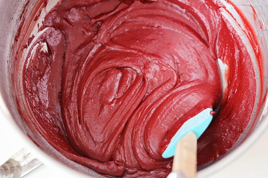 Batter for red velvet cheesecake brownies in a mixing bowl.