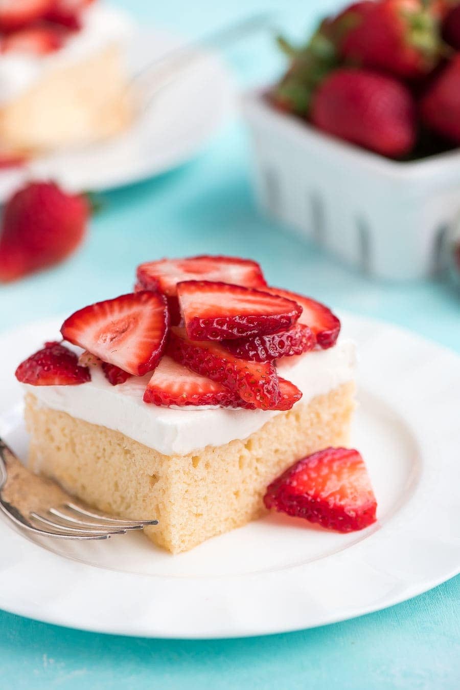 Easy Tres Leches Cake topped with fresh strawberries