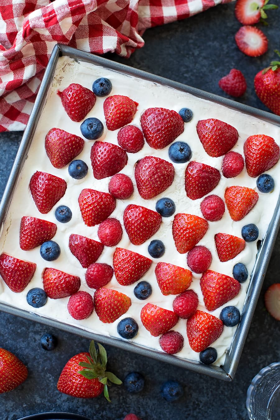 Frosted icebox cake topped with fresh berries