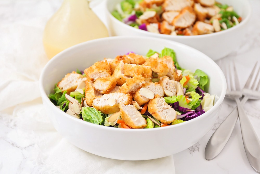 Applebee's oriental chicken salad served in a white bowl.