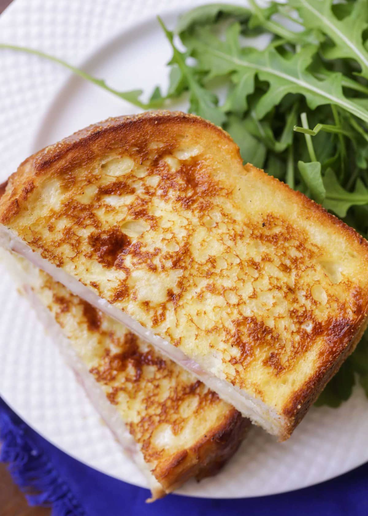 Easy Croque Monsieur recipe served with arugula on the side