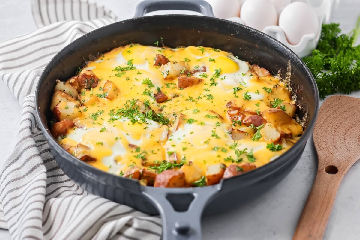 Eggs and potatoes topped with herbs.