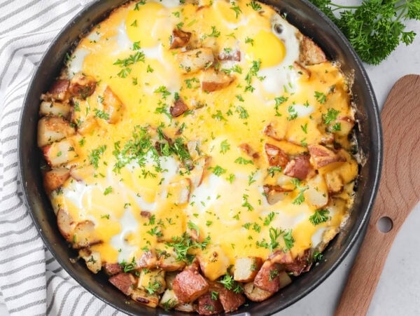 A skillet of eggs and potatoes.