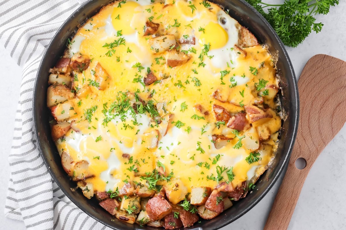 A skillet of eggs and potatoes.