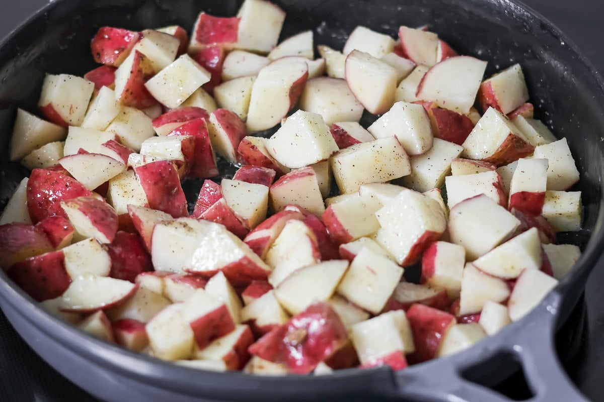 Cut potatoes in a skillet for eggs and potatoes.