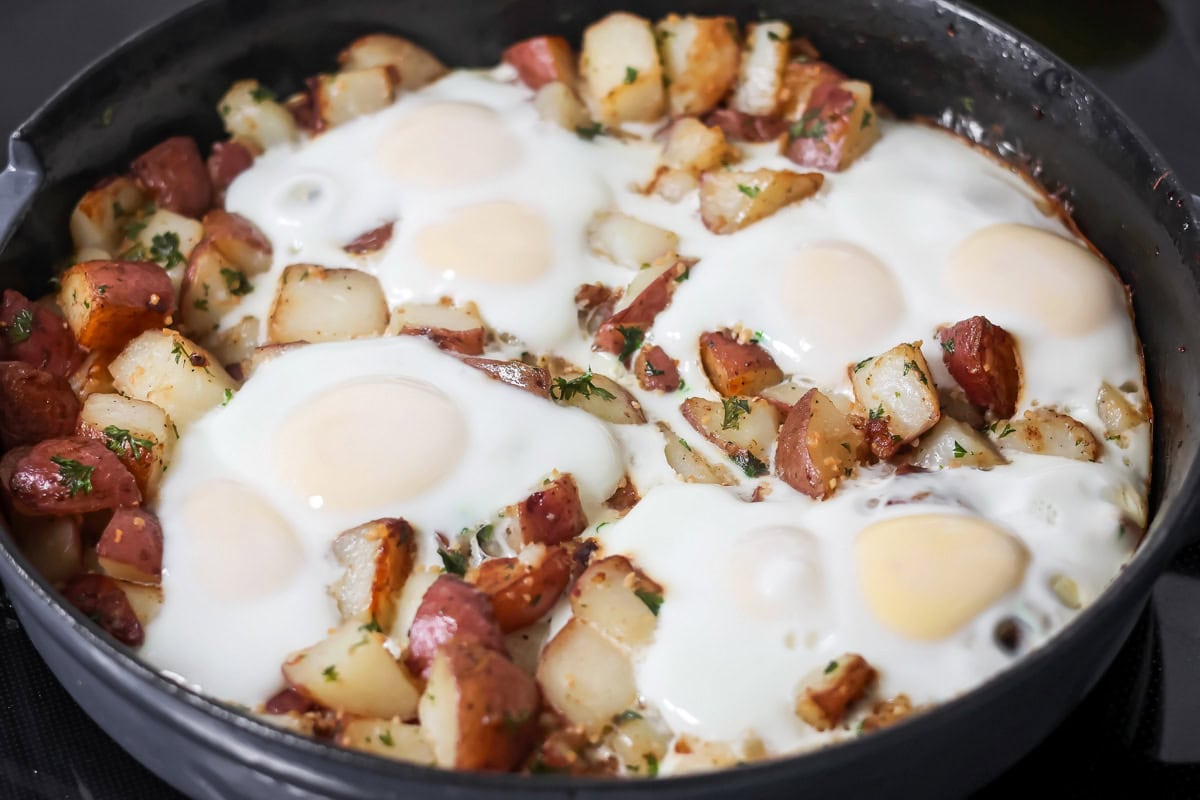 A skillet of eggs and potatoes.