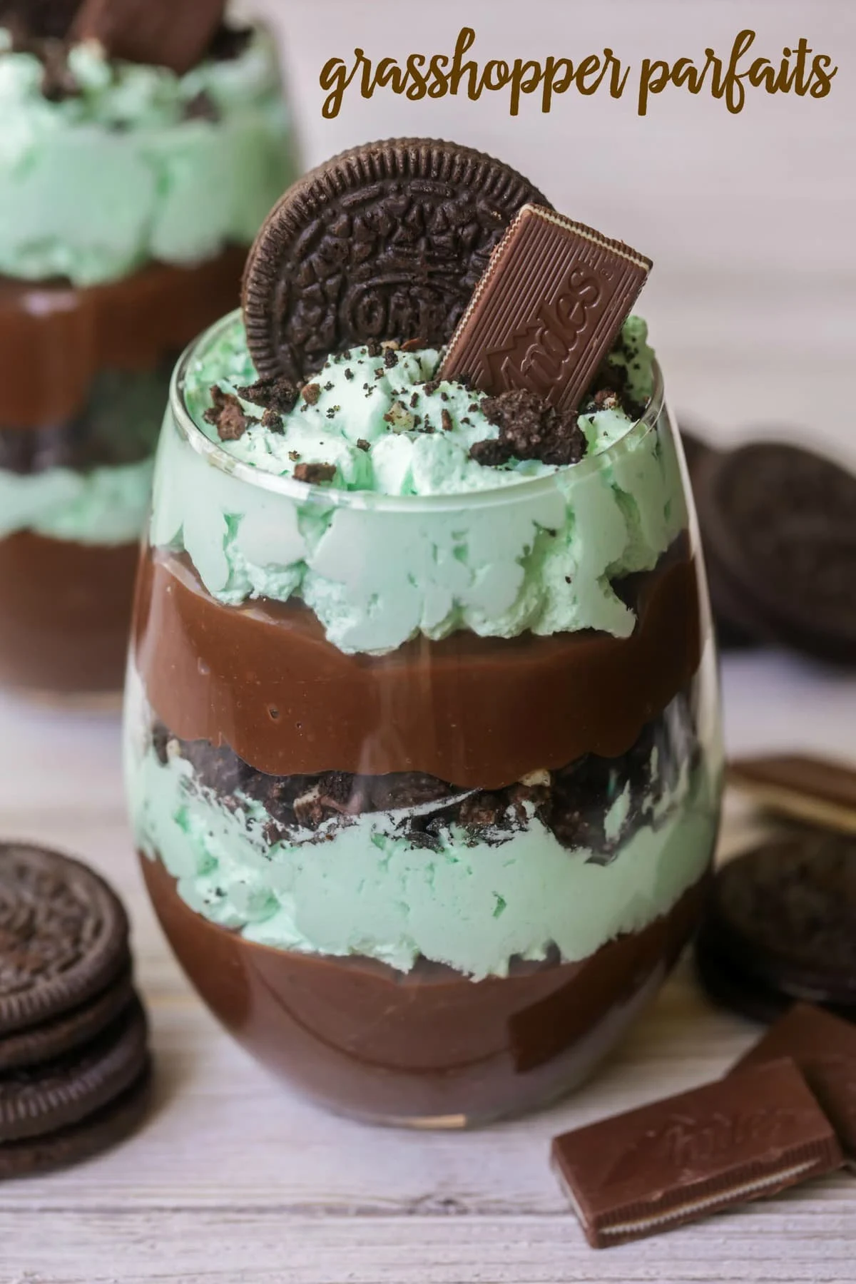 grasshopper parfait layers of chocolate pudding, mint whipped cream, Crushed Oreos and Andes chocolates in a glass cup