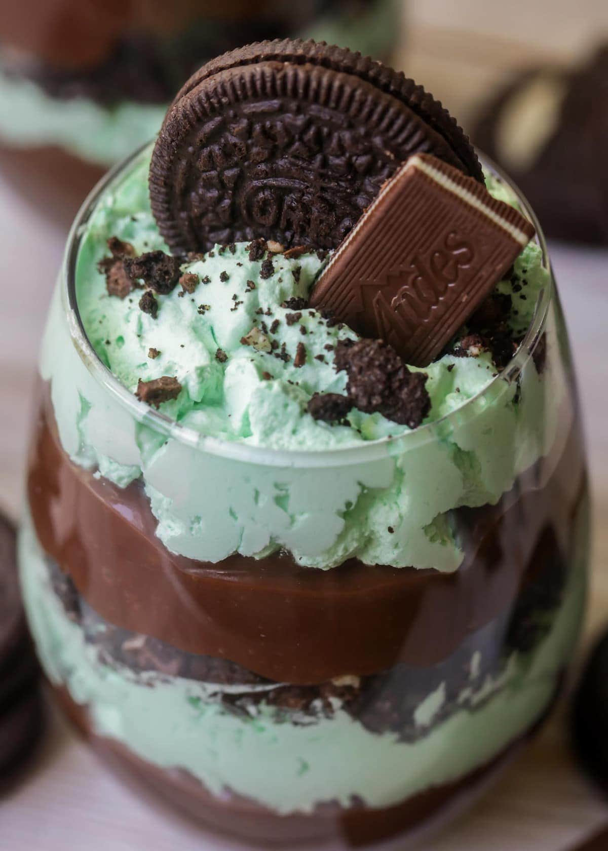 layers pudding and whipped cream in a glass cup