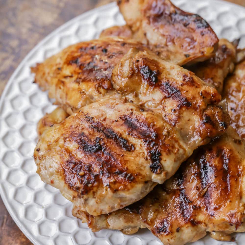 Summer Recipes - Grilled huli huli chicken breasts on a white plate.