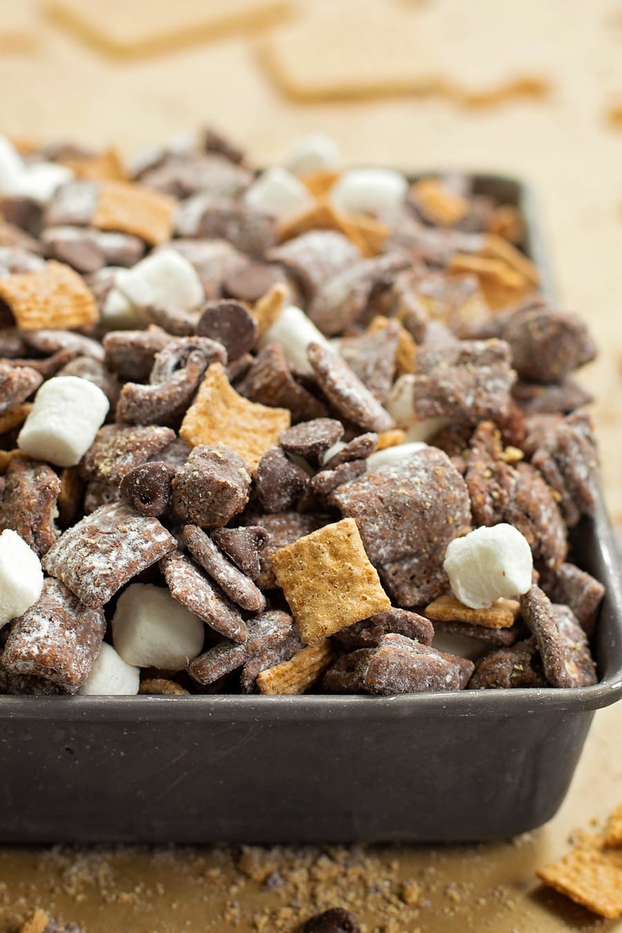 close up of s'mores puppy chow in a baking dish