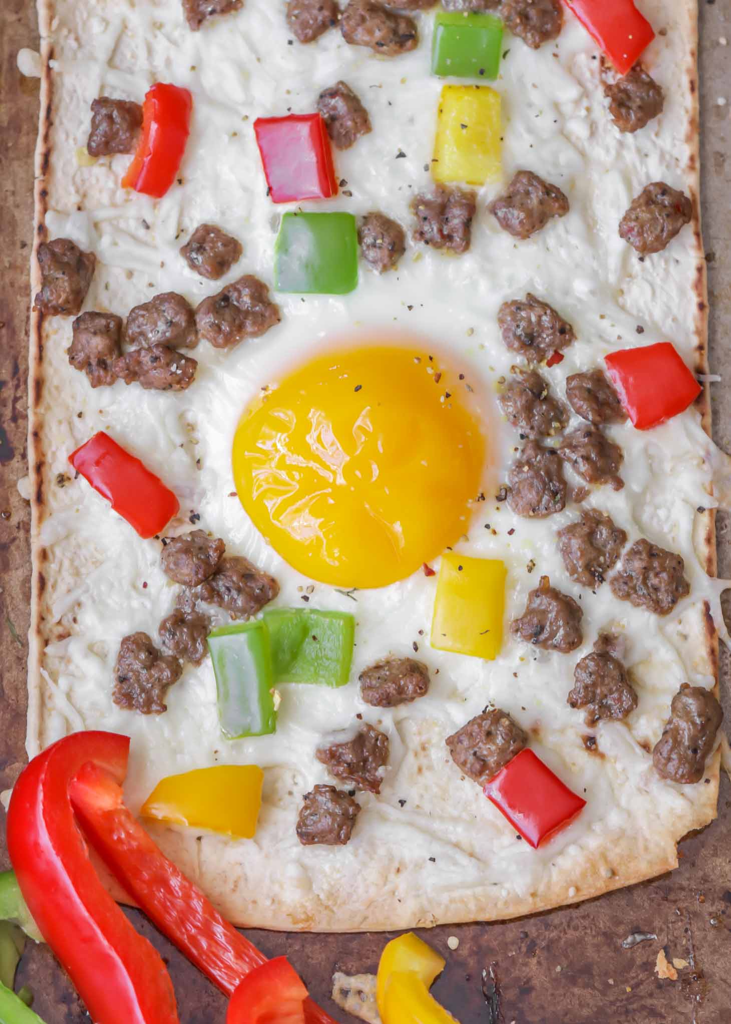 Delicious Healthy Flatbread Breakfast Pizzas topped with sausage and peppers