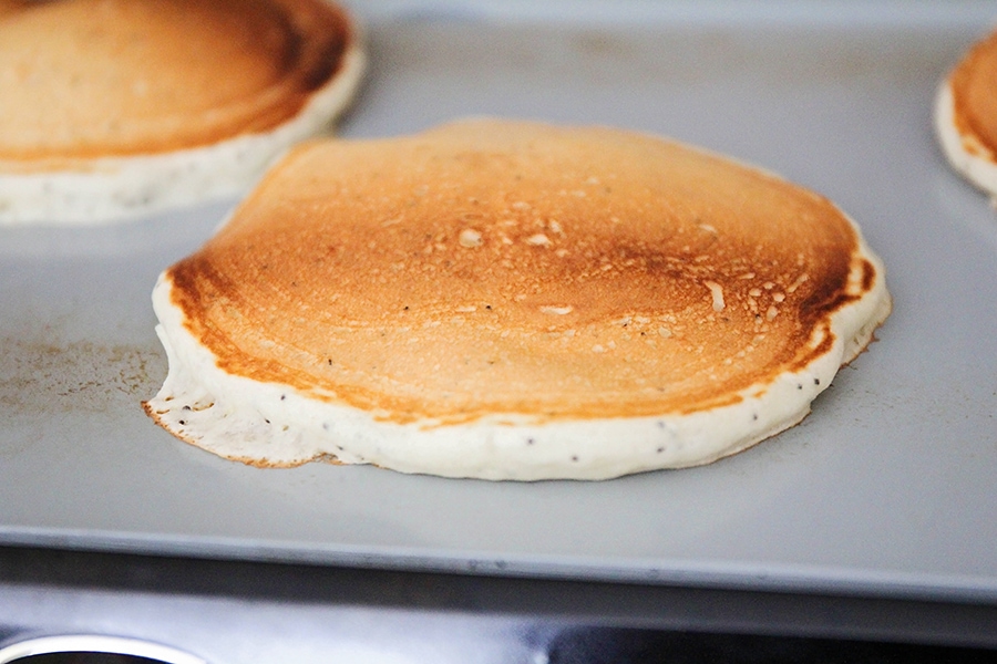 Pancakes cooking on a griddle