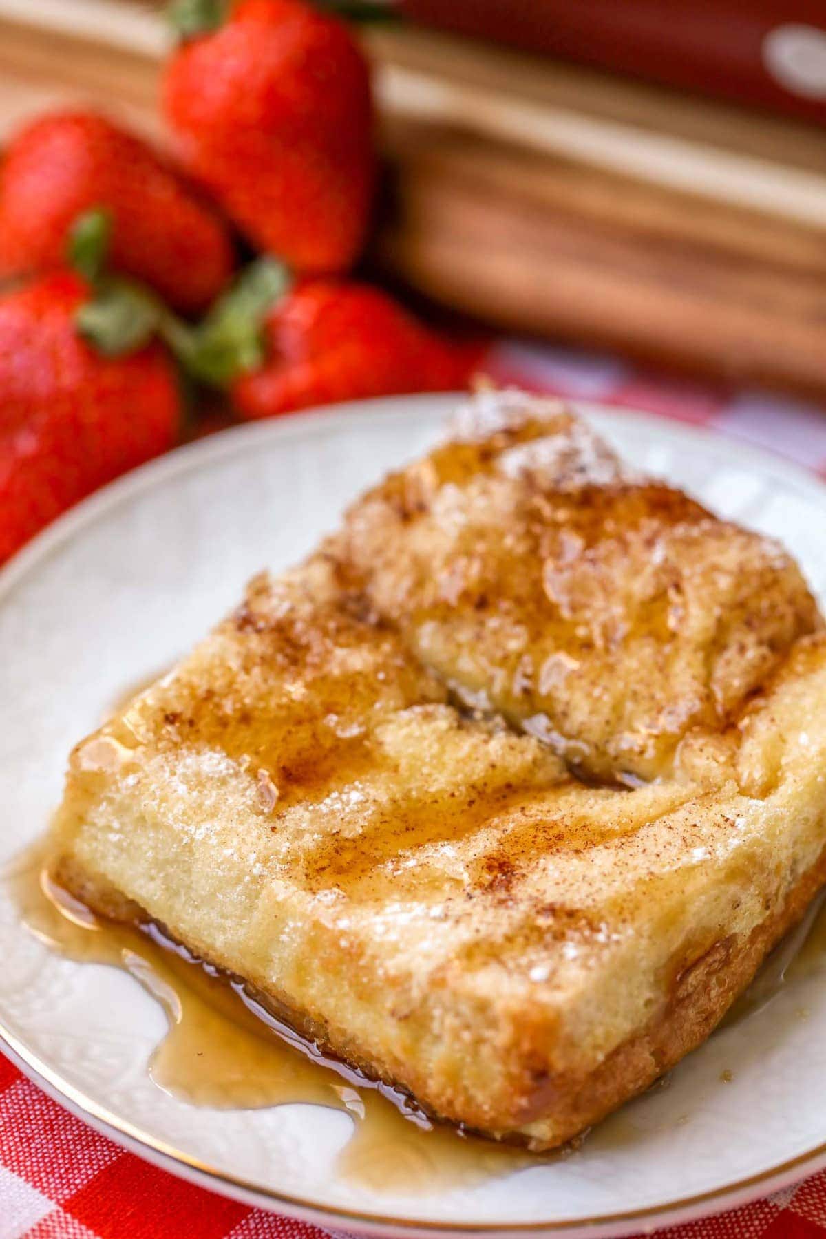 Baked French Toast recipe with syrup on plate