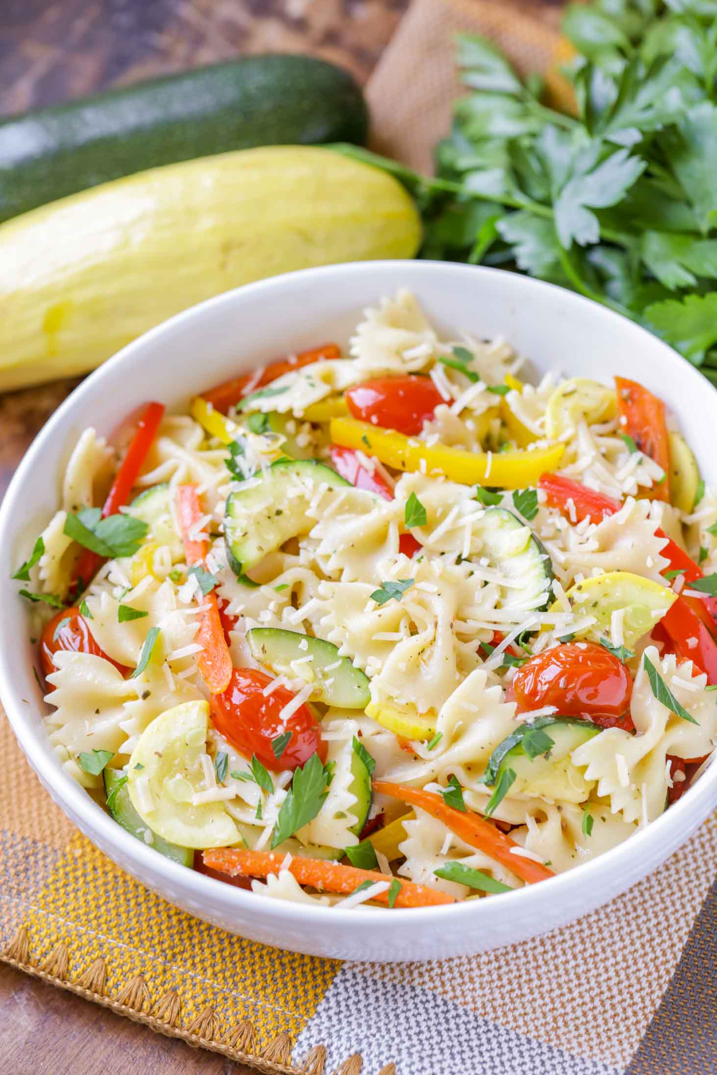 Pasta primavera served in a white bowl.