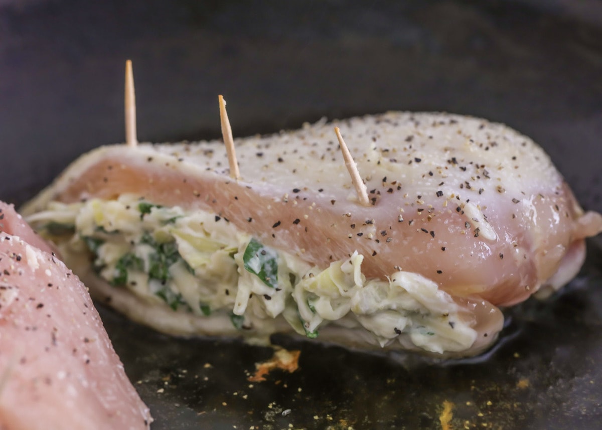 Spinach Artichoke stuffed chicken with toothpicks