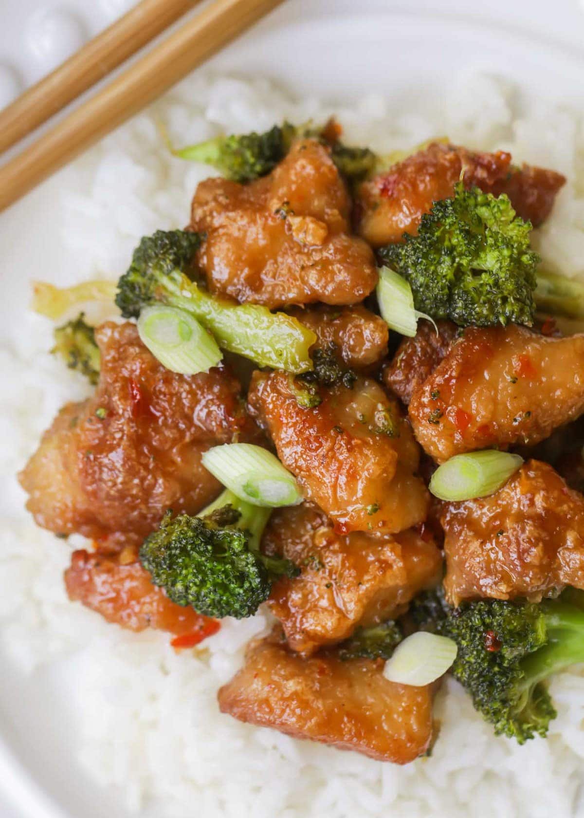 General Tso's chicken on top of white rice with broccoli